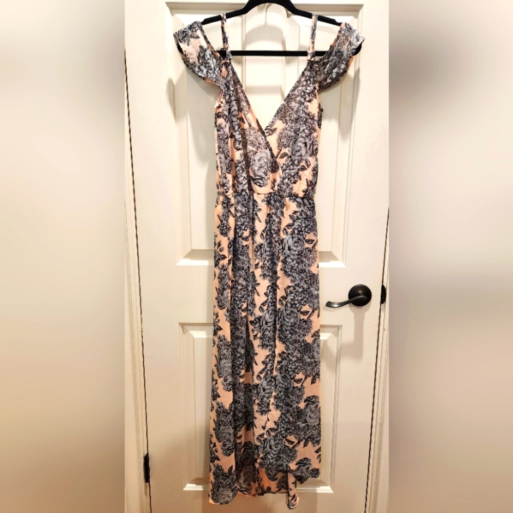 Flowing high-low dress with peek a boo shorts. Size: Small.